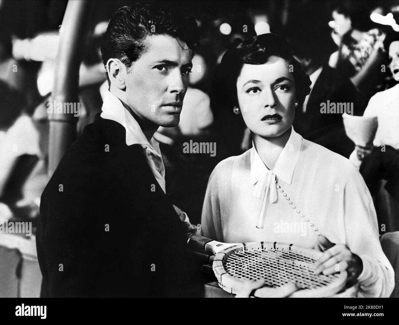 Farley Granger & Ruth Roman Film: Strangers On A Train (USA 1951) Characters: Guy Haines, Anne Morton  Director: Alfred Hitchcock 30 June 1951   **WARNING** This Photograph is for editorial use only and is the copyright of WARNER BROS. and/or the Photographer assigned by the Film or Production Company and can only be reproduced by publications in conjunction with the promotion of the above Film. A Mandatory Credit To WARNER BROS. is required. The Photographer should also be credited when known. No commercial use can be granted without written authority from the Film Company. Stock Photo