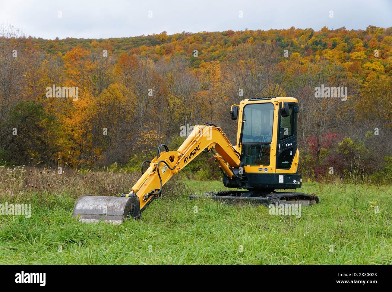 Upstate New York, U.S.A October 17, 2022 A yellow Hyundai tractor