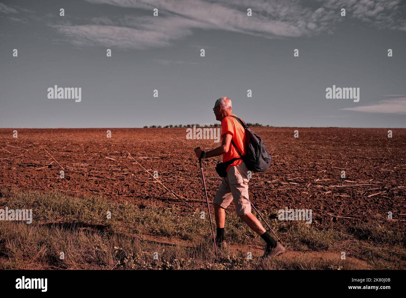 Man hiking walking poles hi-res stock photography and images - Alamy