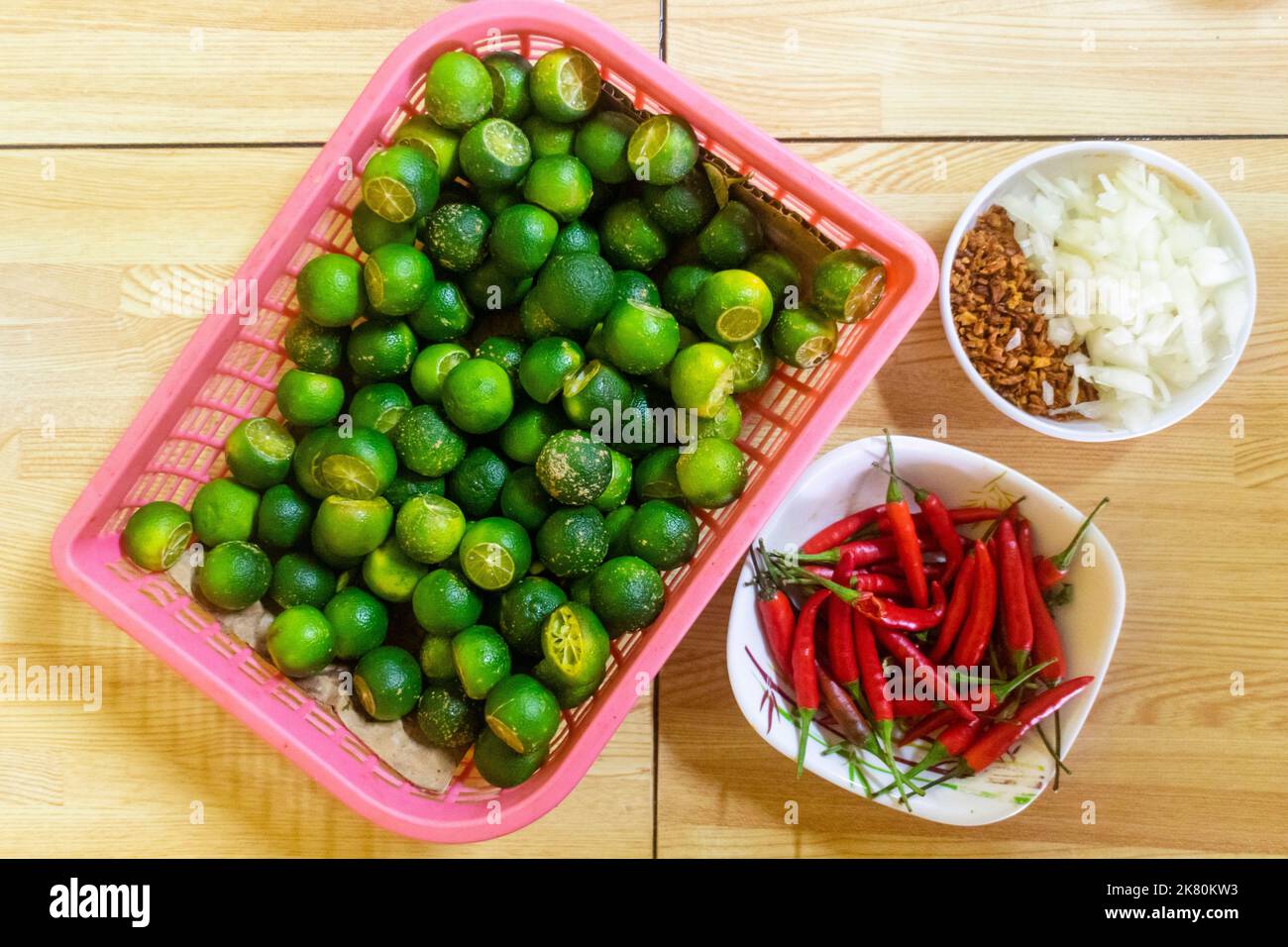 Calamansi, peppers, onions and garlic that are used to mix in a local noodle dish called lomi in Batangas, Philippines Stock Photo