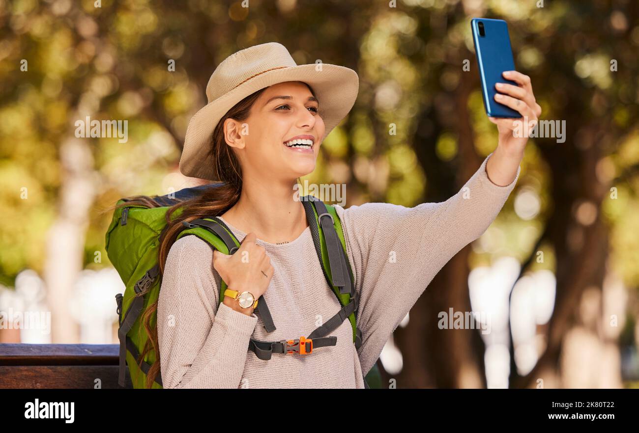 Phone, selfie and travel with a woman using 5g mobile technology to post a photograph to social media. Internet, backpack and communication with a Stock Photo