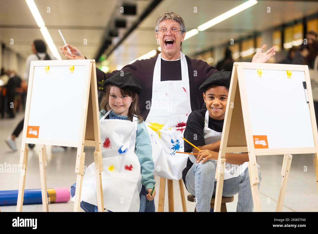 Former Art Attack presenter Neil Buchanan is joined by Sebastian and Amelia to launch easyJet's 'AirCraft' campaign, an initiative that will see free arts materials provided onboard flights during the autumn school holidays. Issue date: Thursday October 20, 2022. Stock Photo