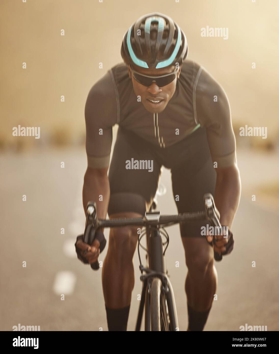 Fitness, sports and cycling man workout in a road at sunset, health