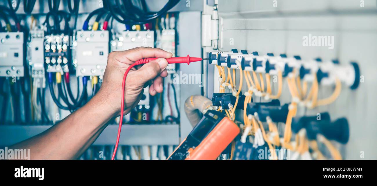 Electrical engineer checking the operation of electrical control