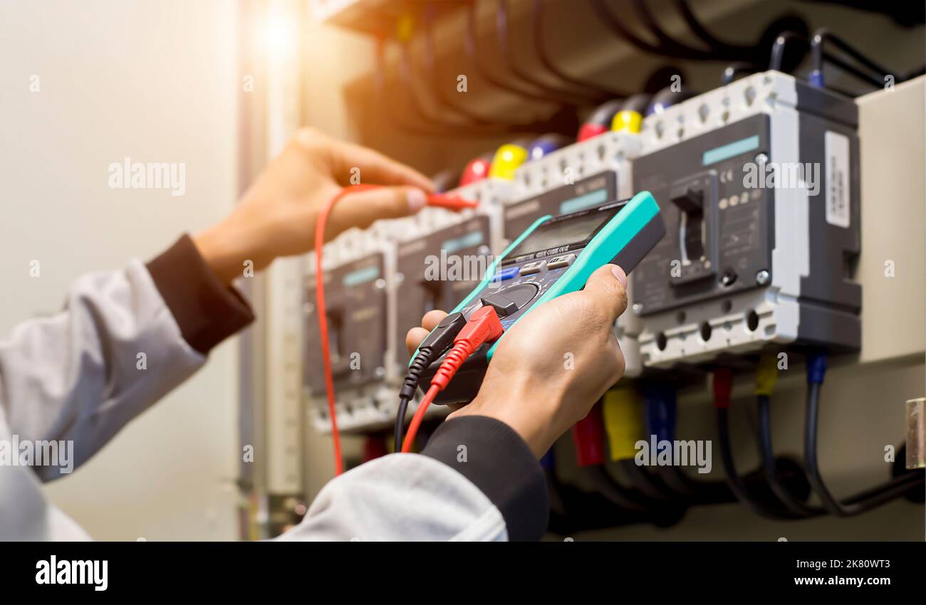 Electrician engineer work tester measuring voltage and current of power