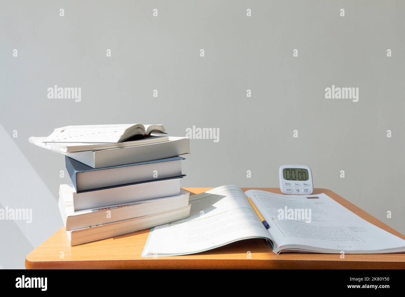 studying at home, study desk setup stack of workbooks Stock Photo Alamy
