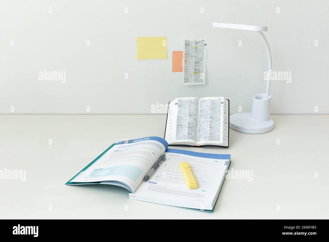 studying at home, study desk setup dictionaries and workbooks Stock