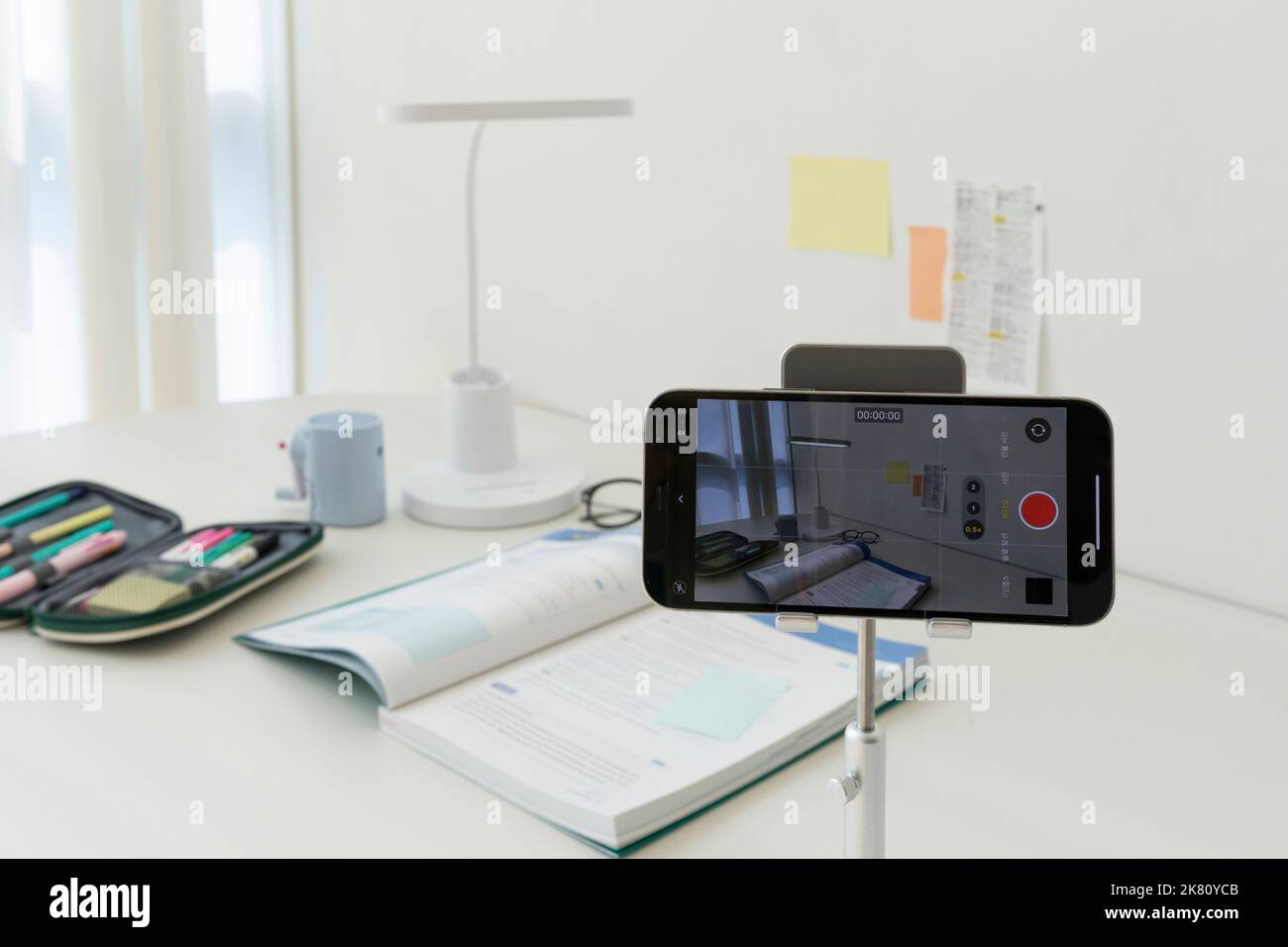 studying at home, study desk setup filming a study video Stock Photo