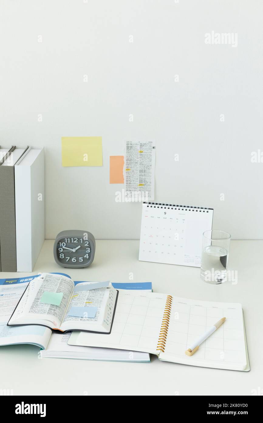 studying at home, study desk setup studying dictionaries and workbooks