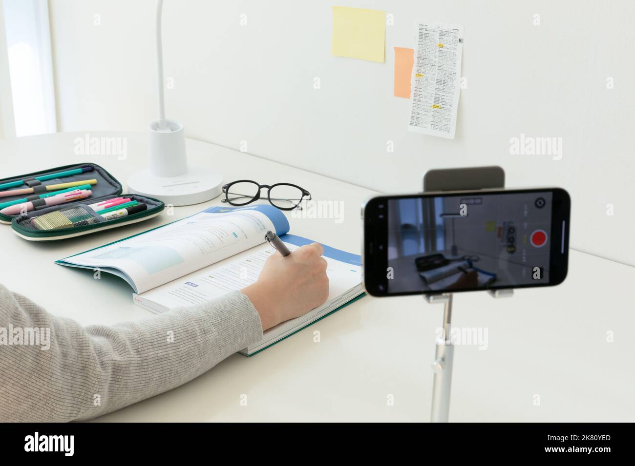 studying at home, study desk setup filming a study video Stock Photo