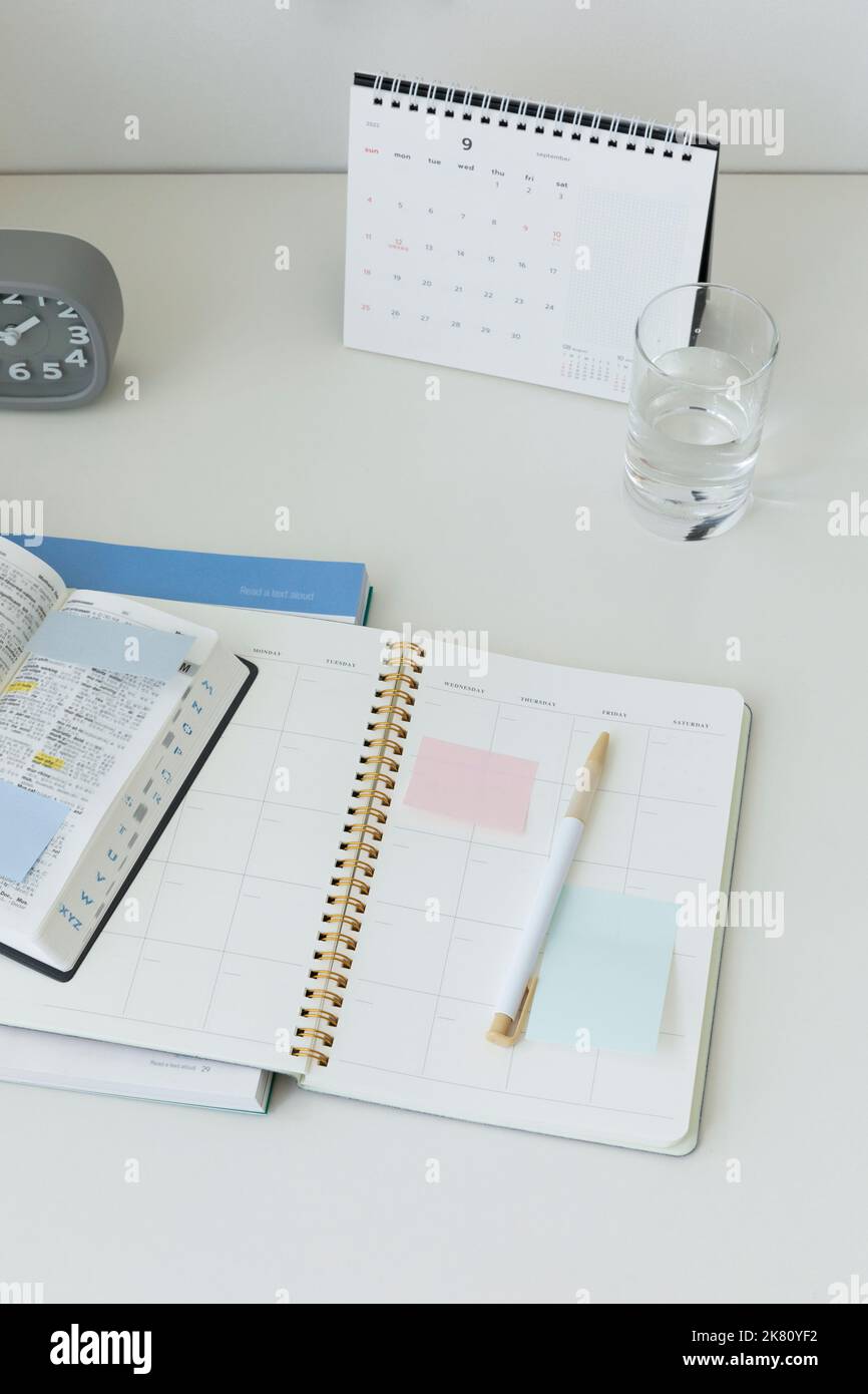 studying at home, study desk setup studying dictionaries and workbooks