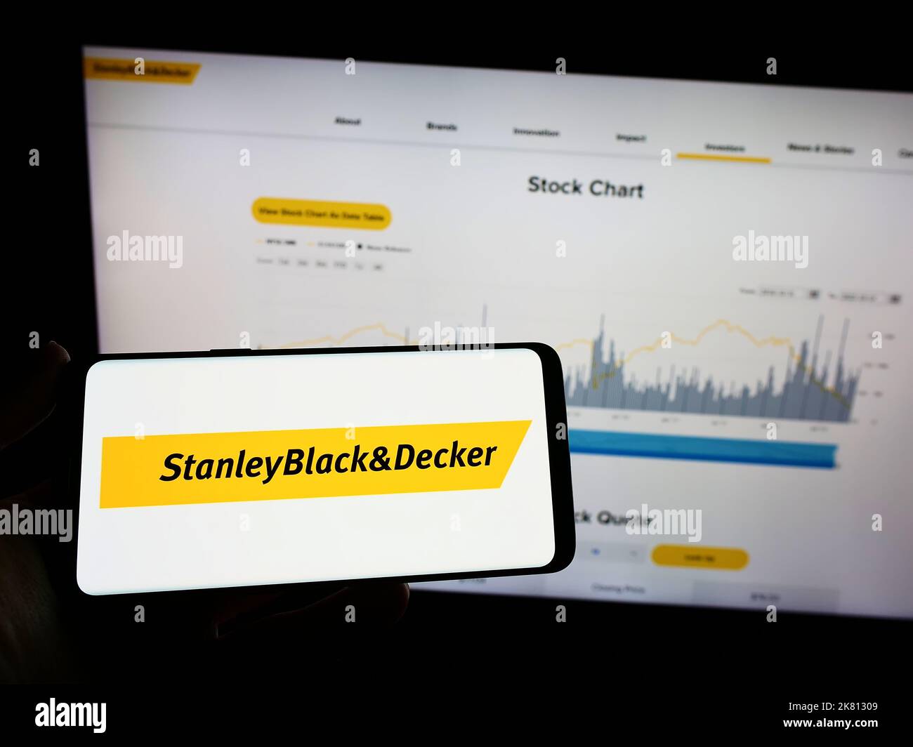 https://c8.alamy.com/comp/2K81309/person-holding-mobile-phone-with-logo-of-us-tools-company-stanley-black-and-decker-inc-on-screen-in-front-of-web-page-focus-on-phone-display-2K81309.jpg