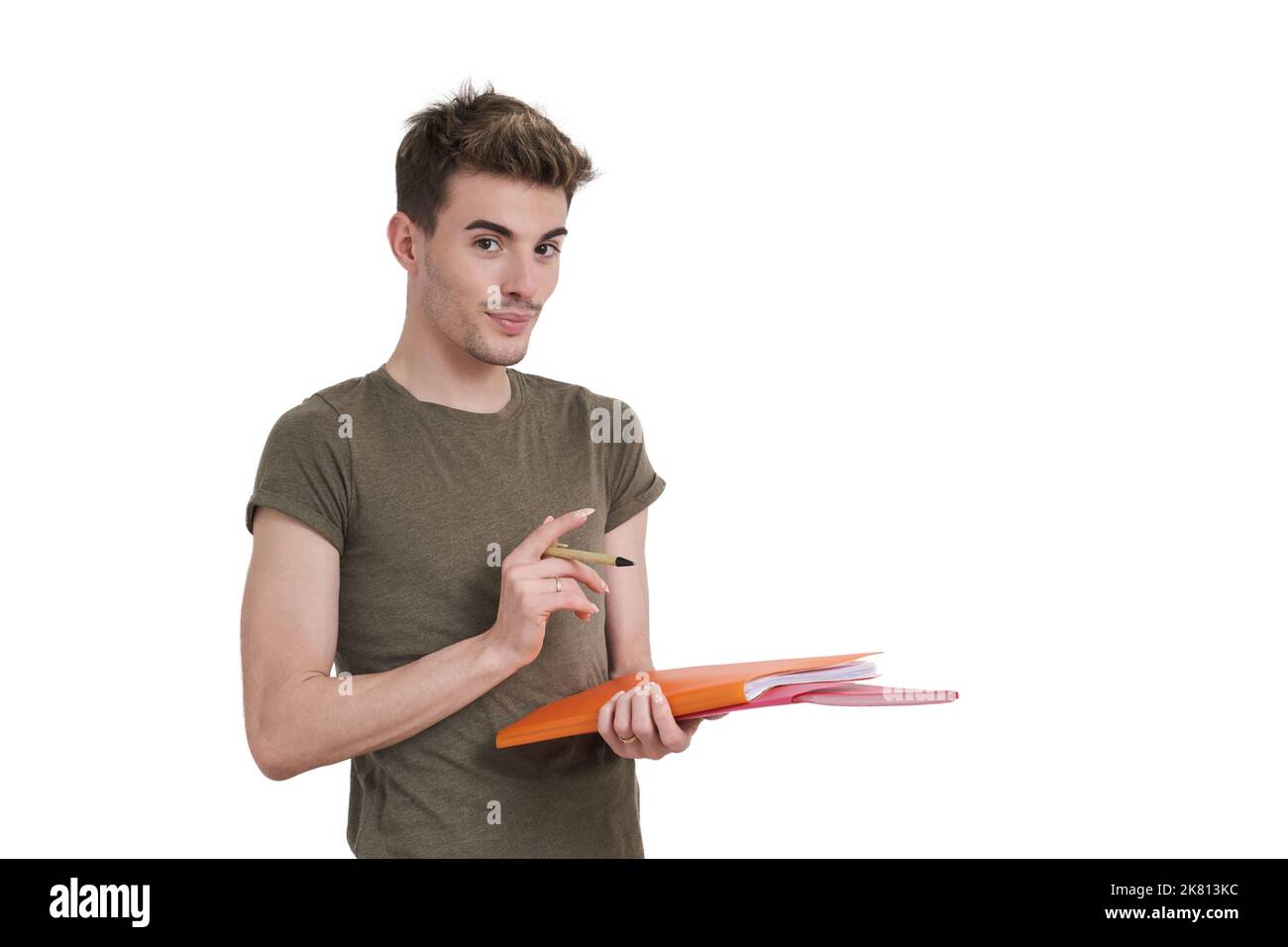 Young caucasian student smiling with pen and folder, isolated. Stock Photo