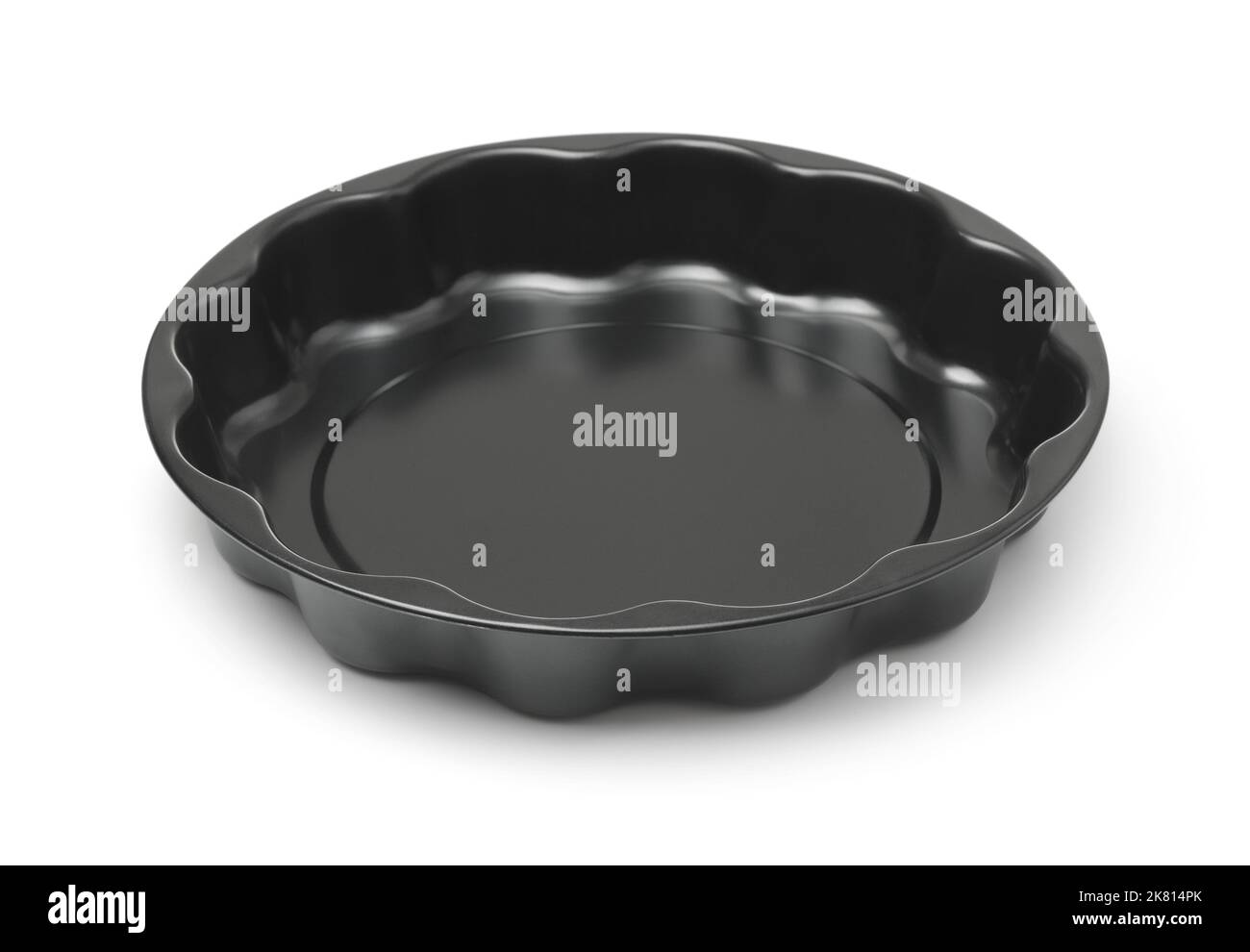 Empty black round metal baking dish isolated on white Stock Photo