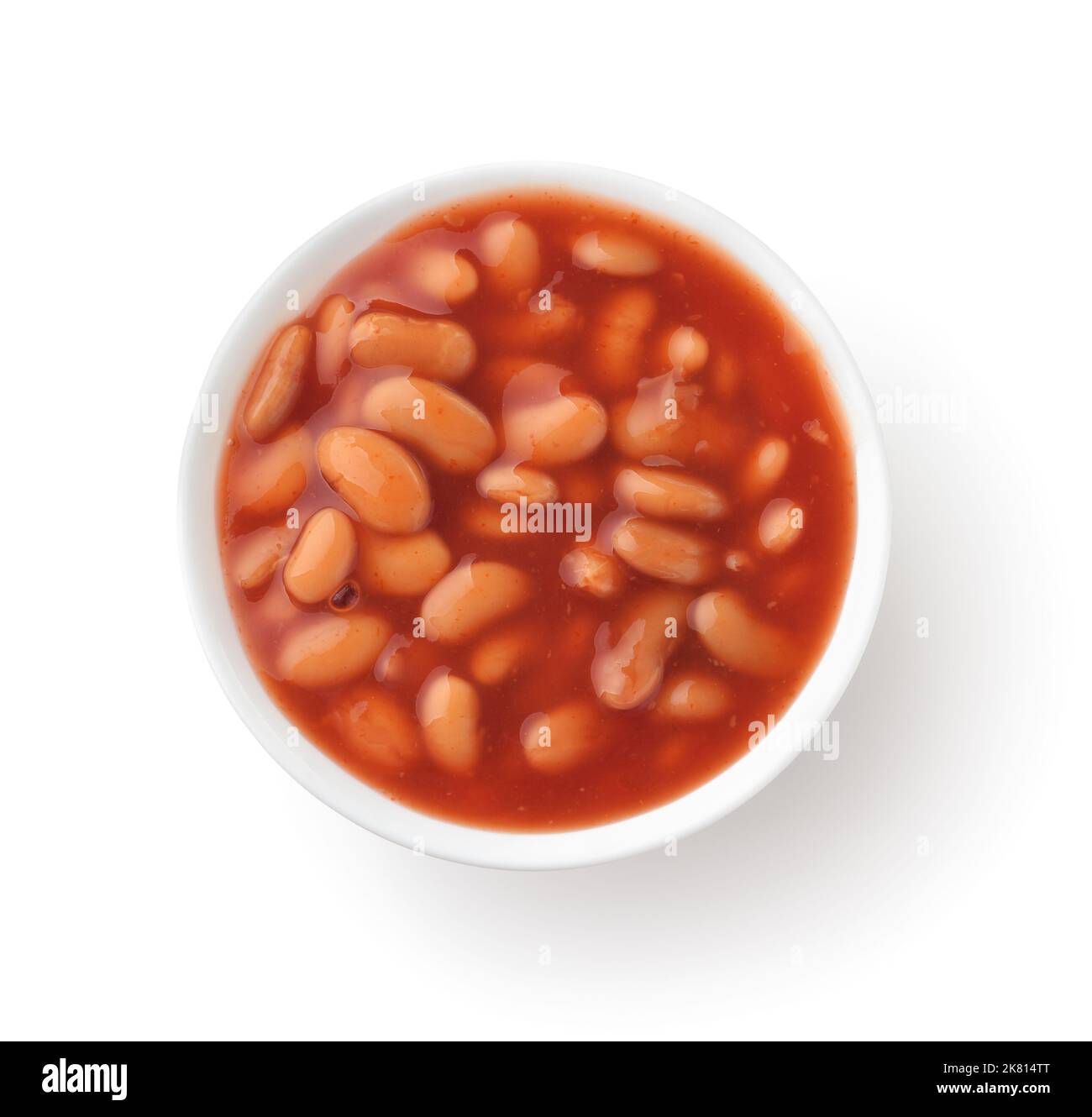 Top view of baked white beans with tomato sauce in ceramic bowl isolated on white Stock Photo