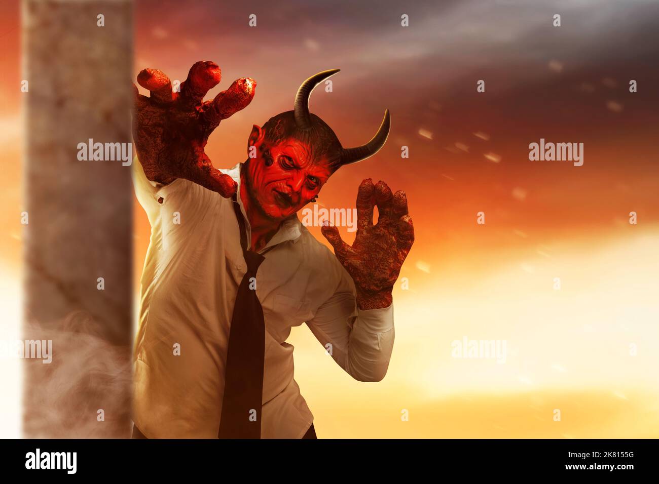 Devilman is standing in the dramatic scene background. Halloween concept Stock Photo