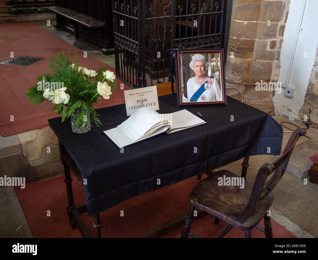 Book of Condolence following the death of Queen Elizabeth II in the church of St Mary and All Saints, Holcot, Northamptonshire, UK Stock Photo