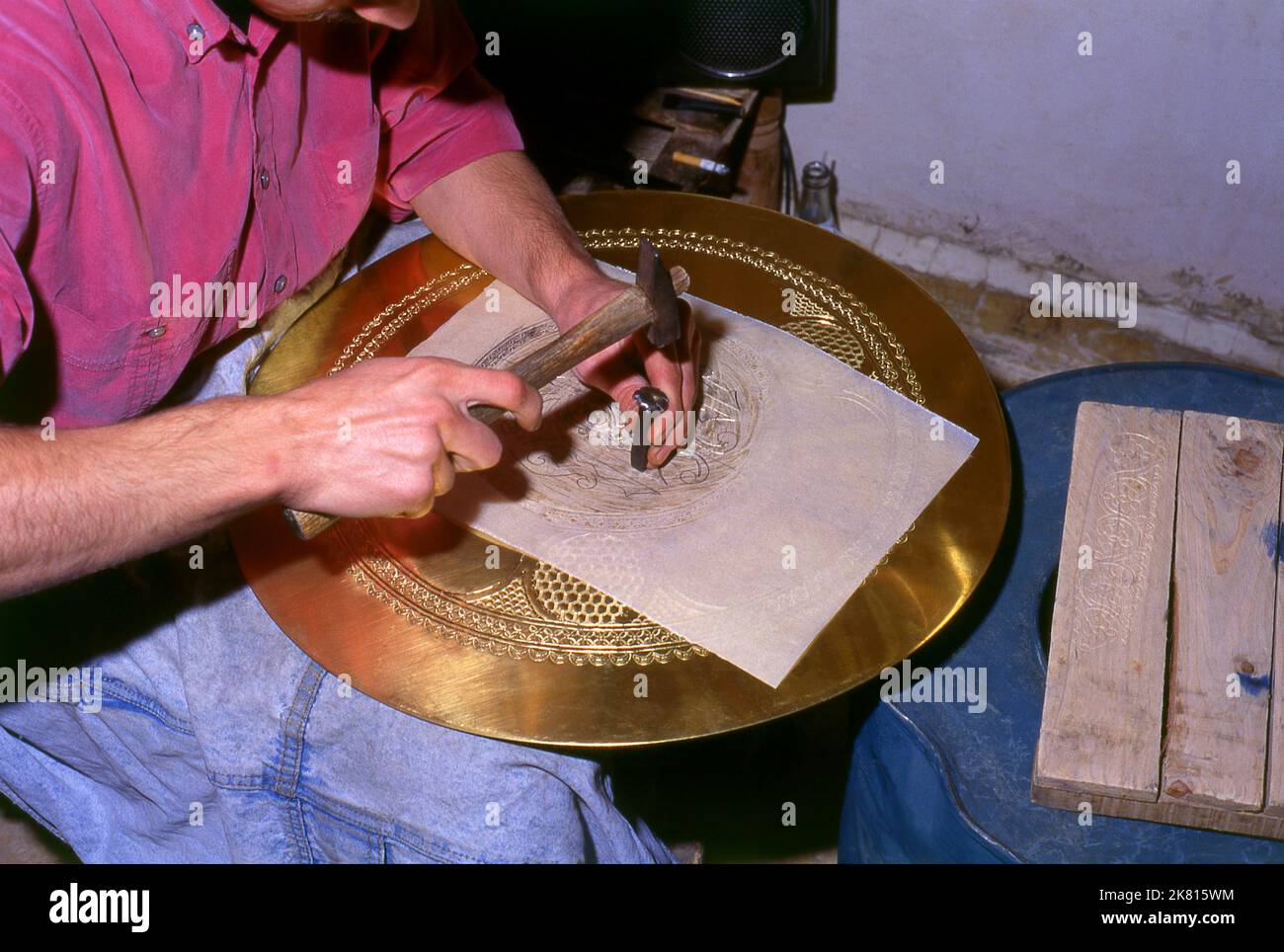 Syria: Brassware artisan in the ancient Great Bazaar, Aleppo (1997). Aleppo's Great Bazaar (in Arabic, suq or souq) was rebuilt first by the Egyptian Mamelukes who drove out the Mongols, and then, after 1516, by the Turks who incorporated Aleppo into the Ottoman Empire. During the Syrian Civil War, which started in 2011, Aleppo's historic suqs suffered serious damage.  Aleppo, the second city of Syria is possibly the longest continually inhabited settlement in the world. Its Arabic name, Halab, is mentioned in Semitic texts of the third millennium BCE. Stock Photo
