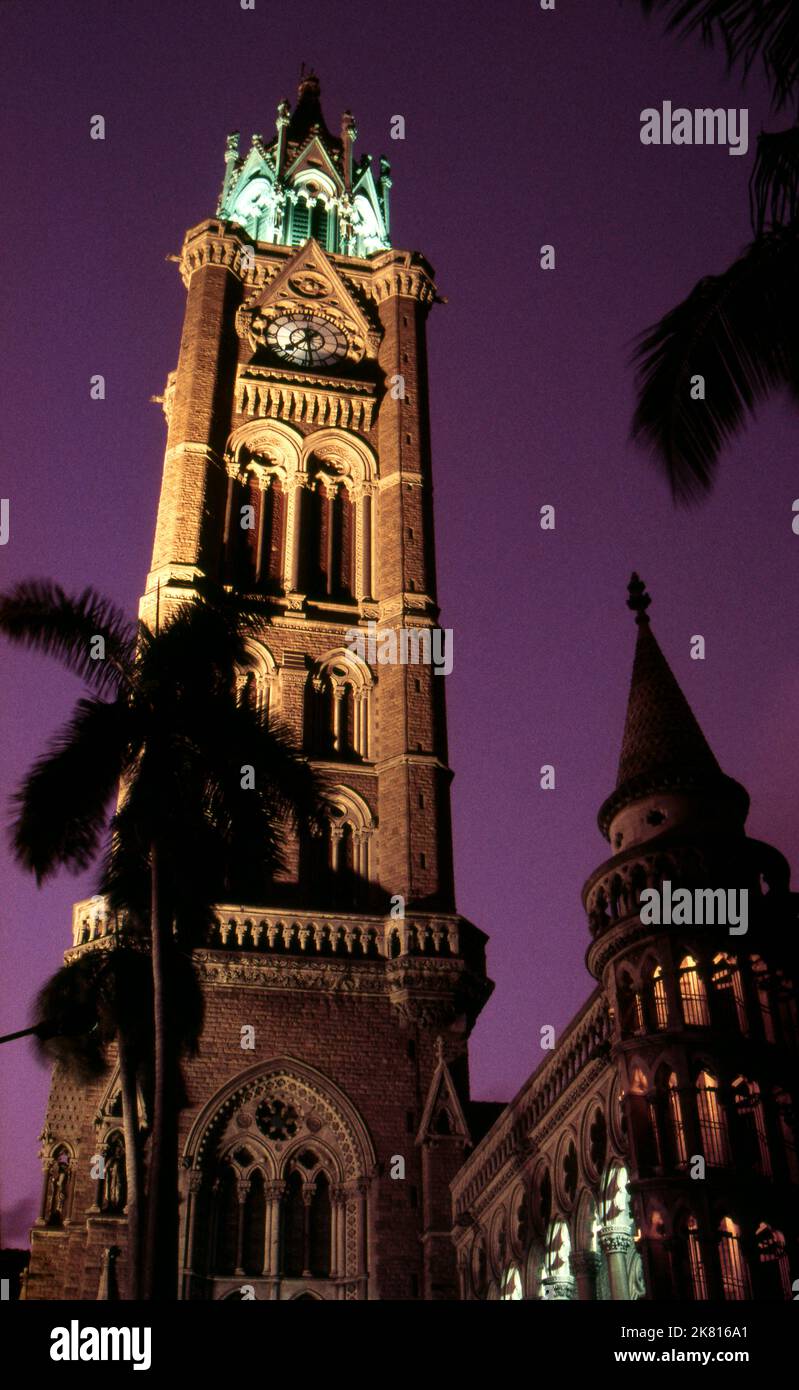 India: The Rajabai Clock Tower and the university library, University of Mumbai, Fort campus, Mumbai, built in so-called‚ Bombay Gothic style. The University of Bombay, as it was originally known, was established in 1857. The Rajabai Tower and library building were designed by Sir George Gilbert Scott and completed in 1878. Stock Photo