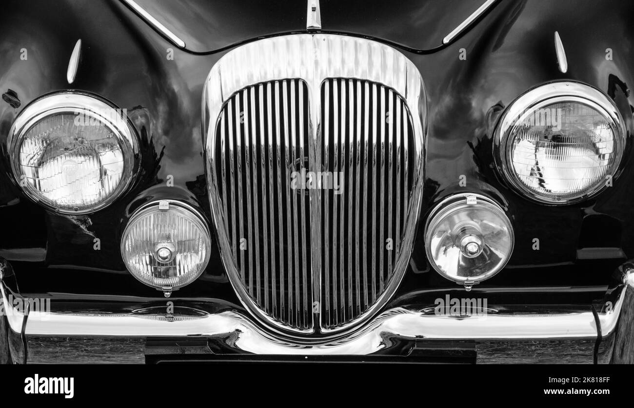 Headlights and Radiator of a black 1960s Daimler Stock Photo