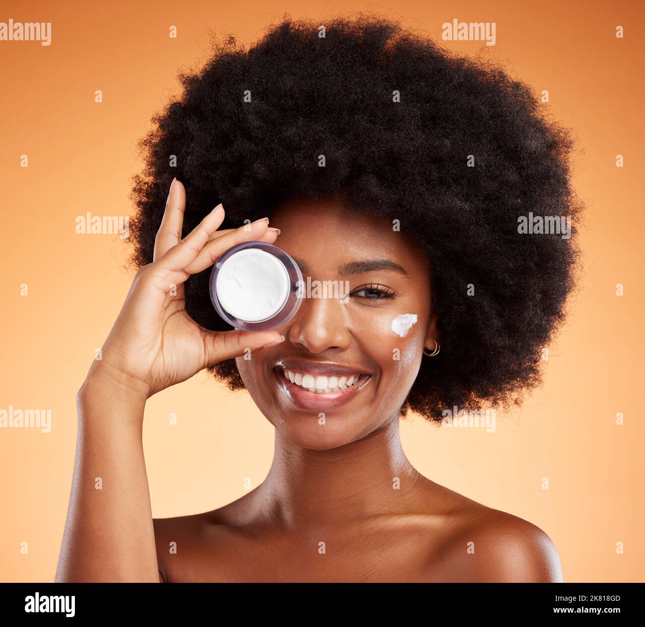 Portrait of black woman with beauty cream product for facial skincare