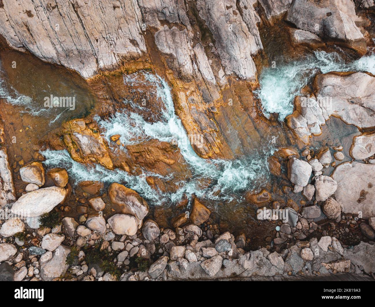 Flow Between Rocks River flowing between rocks with motion blur shot with long exposure ...