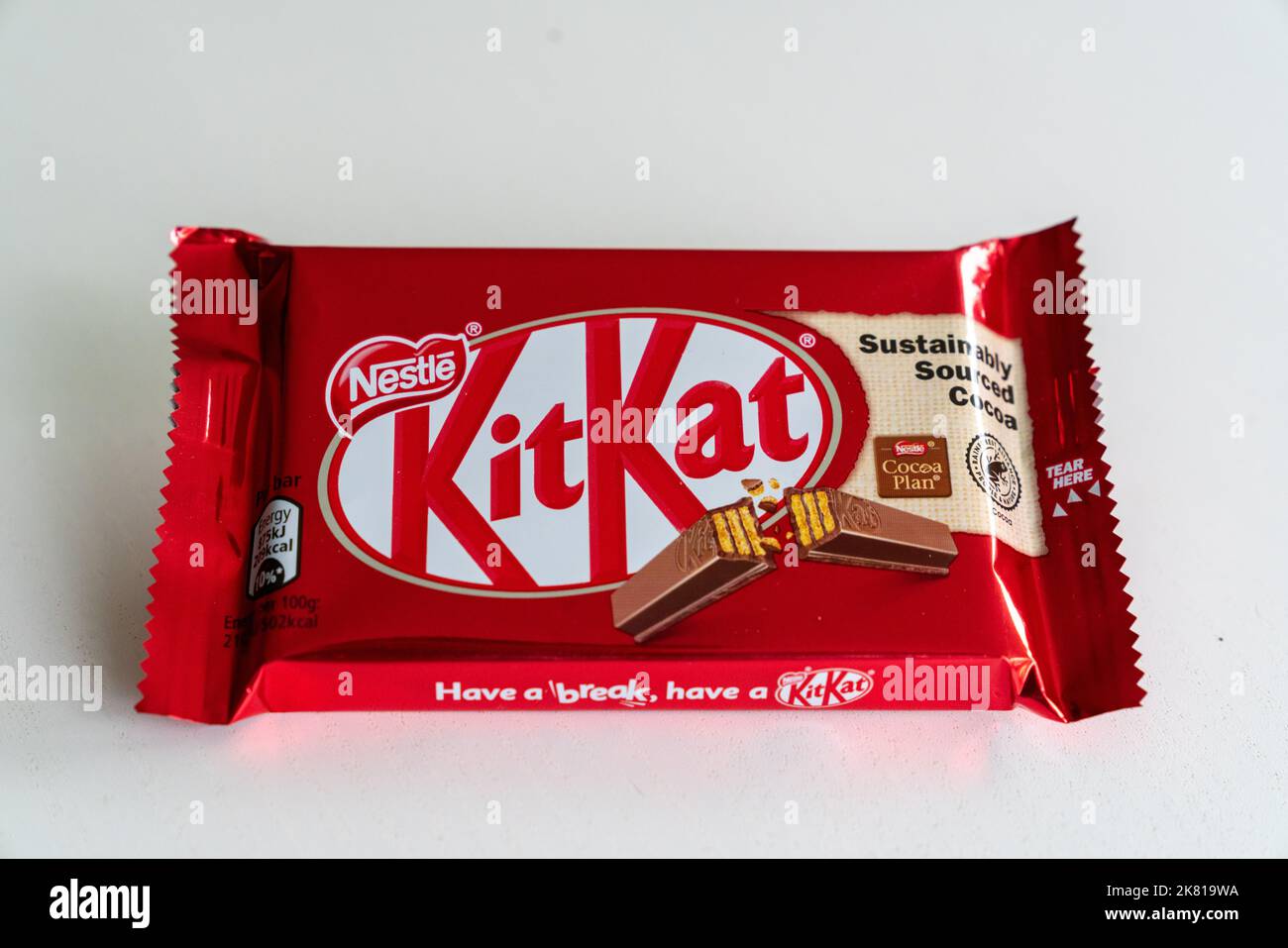 An unopened Nestle Kit Kat bar on a plain background Stock Photo