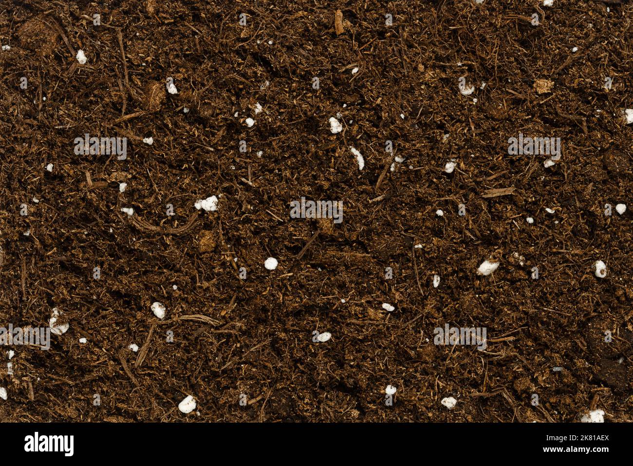 Organic potting compost, background, from above. Soil, growing medium