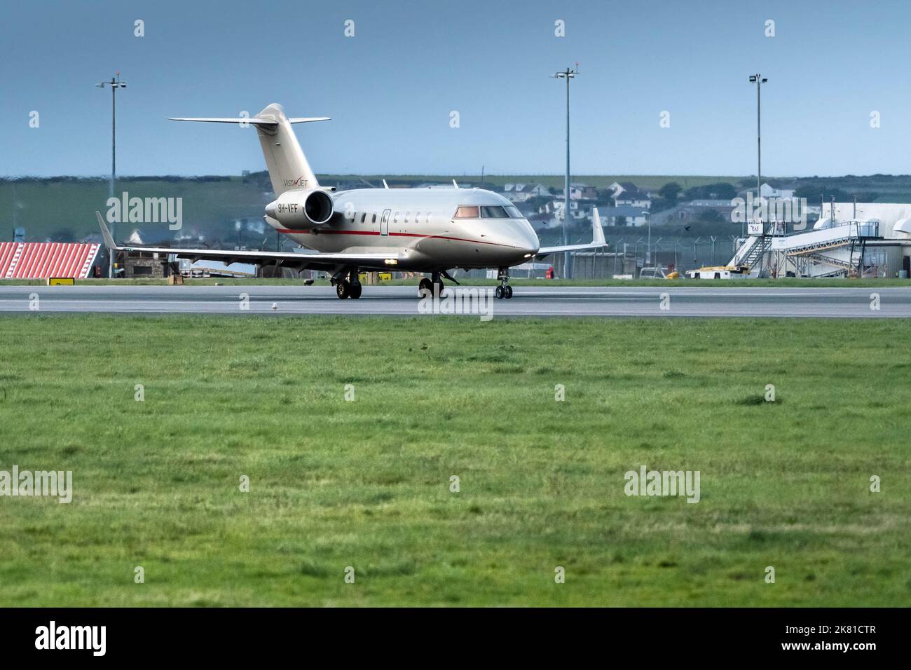 A Bombardier Challenger 605 9H-VFF Vista Jet on the runway at Newquay Airport in Cornwall in the UK. Stock Photo
