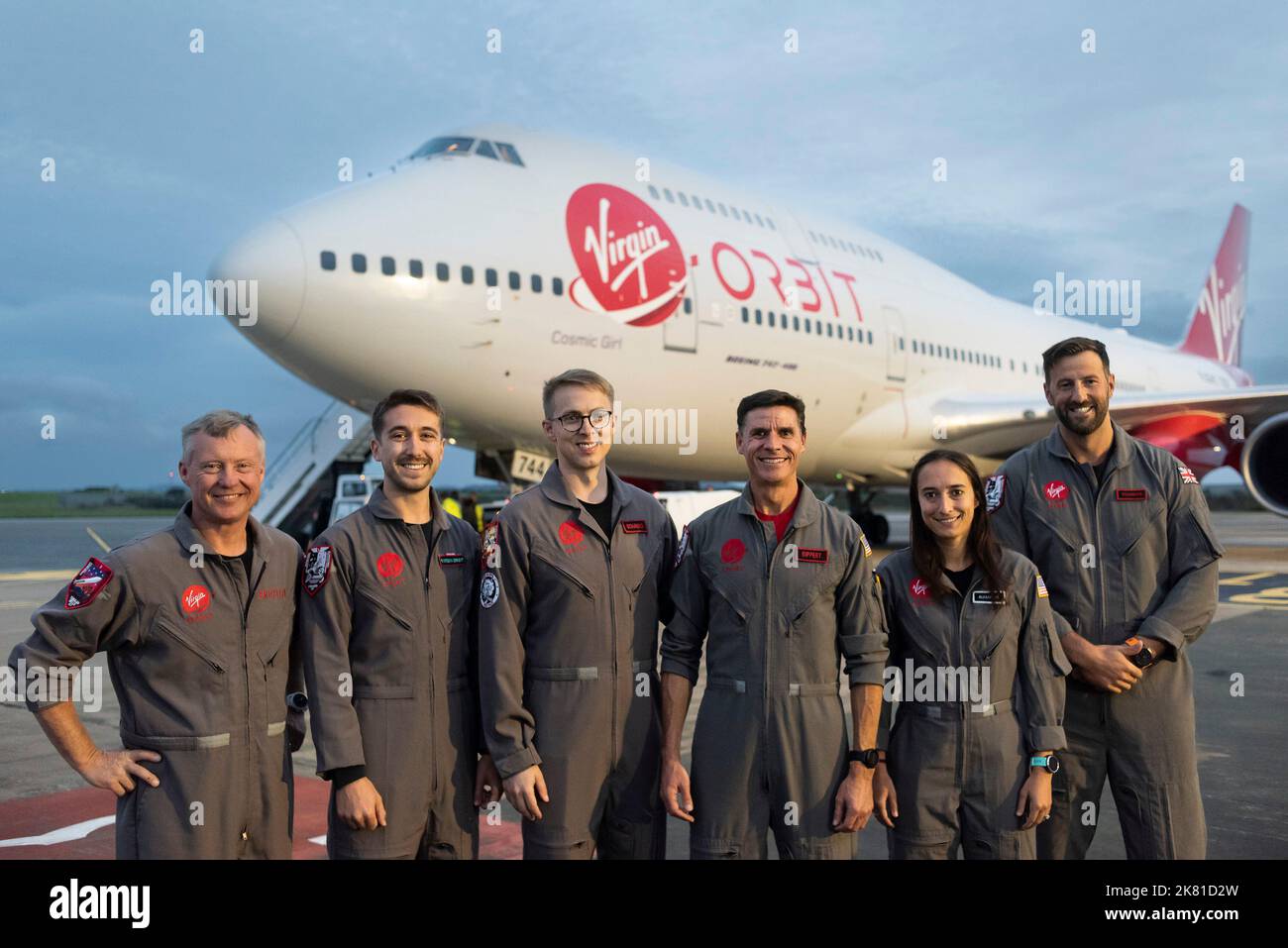 Standing on the right of the photograph is Squadron Leader, Matthew Stannard, Chief Pilot, Virgin Orbit with his crew of the Virgin Orbit’s Cosmic Gir Stock Photo