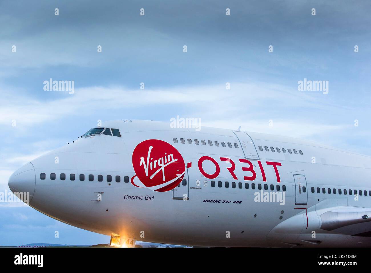 A closeup close up view of the Virgin logo on the fuselage of the Virgin Orbit, Cosmic Girl, a 747-400 converted to a rocket launch platform taxiing t Stock Photo