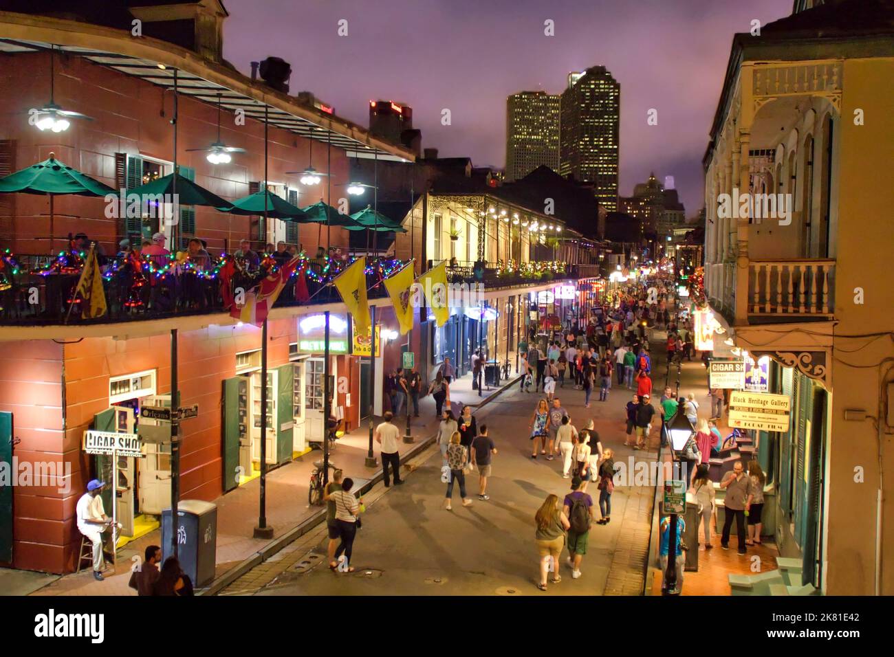 Pedestrians walking on Bourbon Street in New Orleans at night Stock
