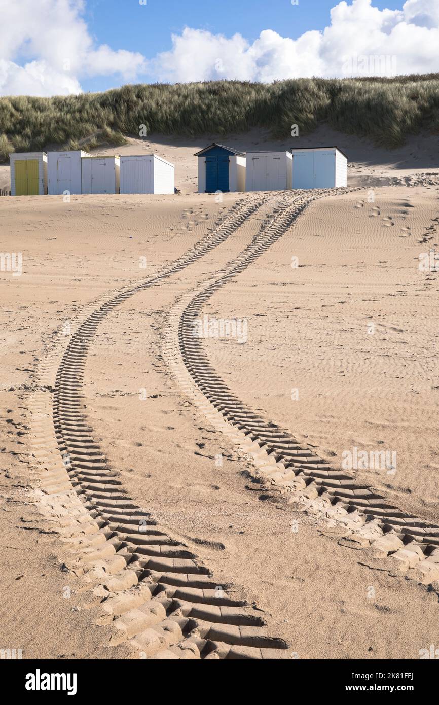 beach cabins and tire track on the beach in Oostkapelle on the peninsula Walcheren, Zeeland, Netherlands. Strandhaeuschen und Reifenspur am Strand von Stock Photo