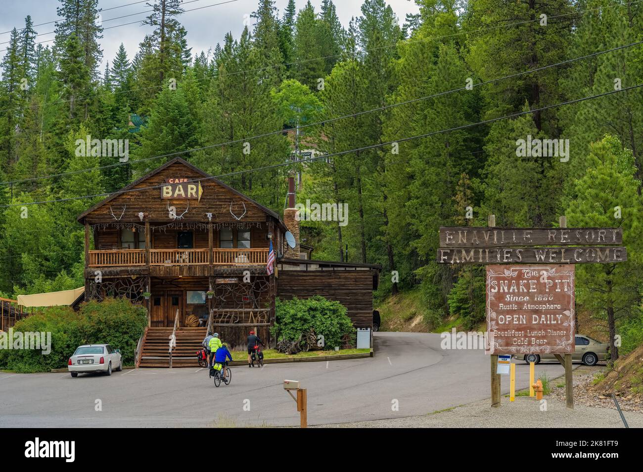 The wooden Snake Pit Bar in a dense green forest Stock Photo - Alamy