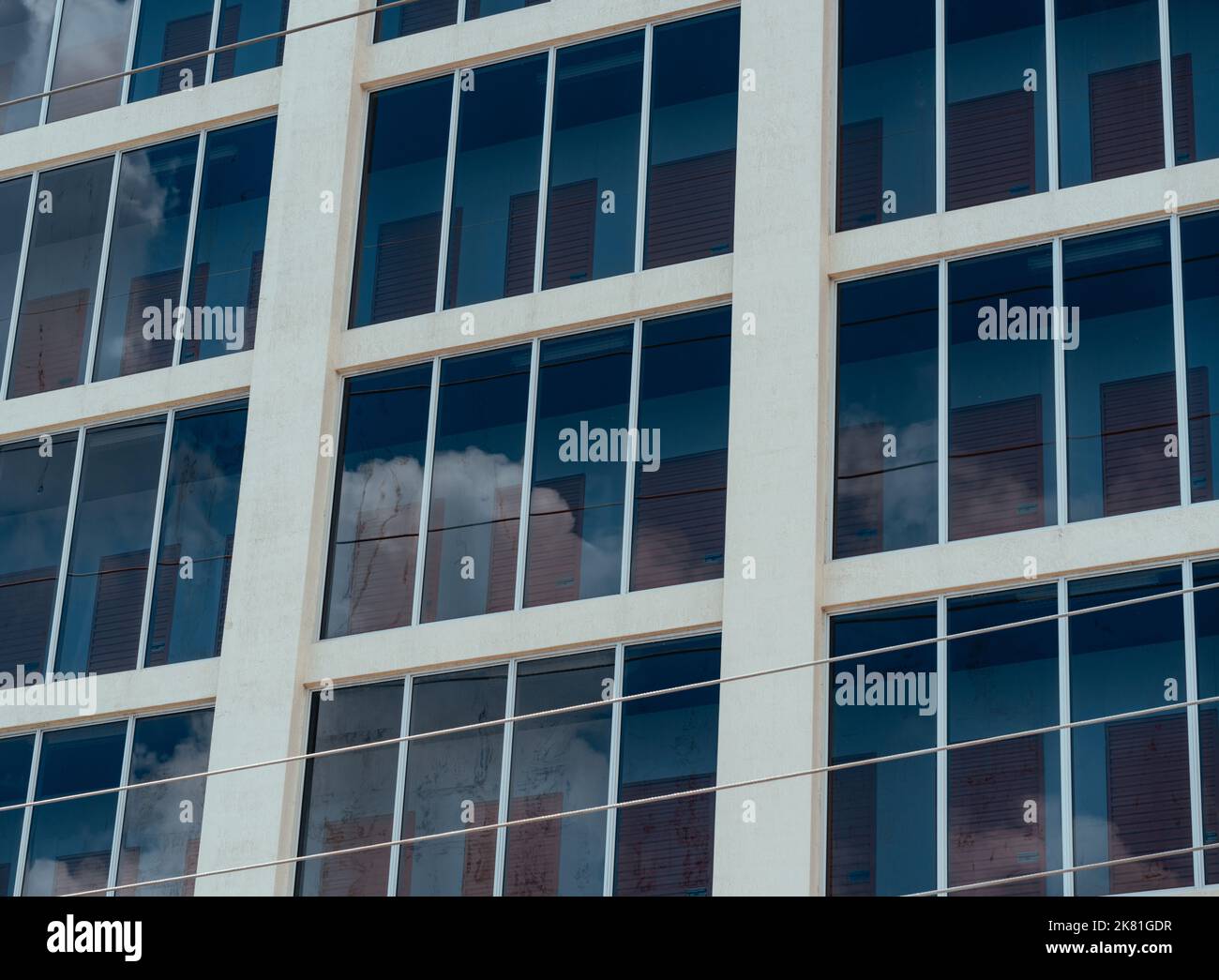 A low-angle shot of glass windows on a building Stock Photo - Alamy