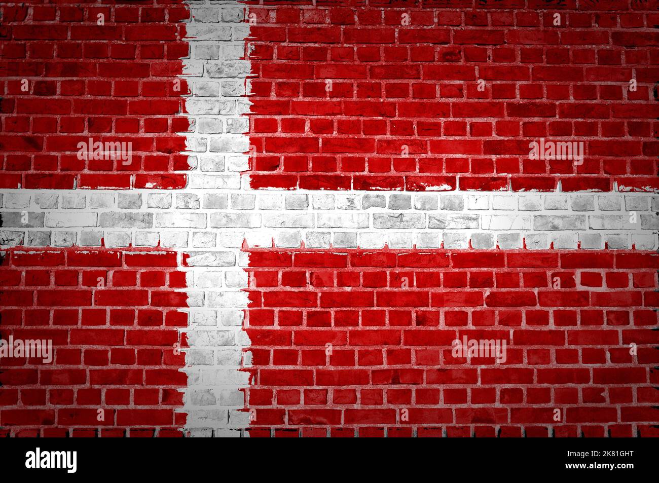 An image of the Denmark flag painted on a brick wall in an urban ...