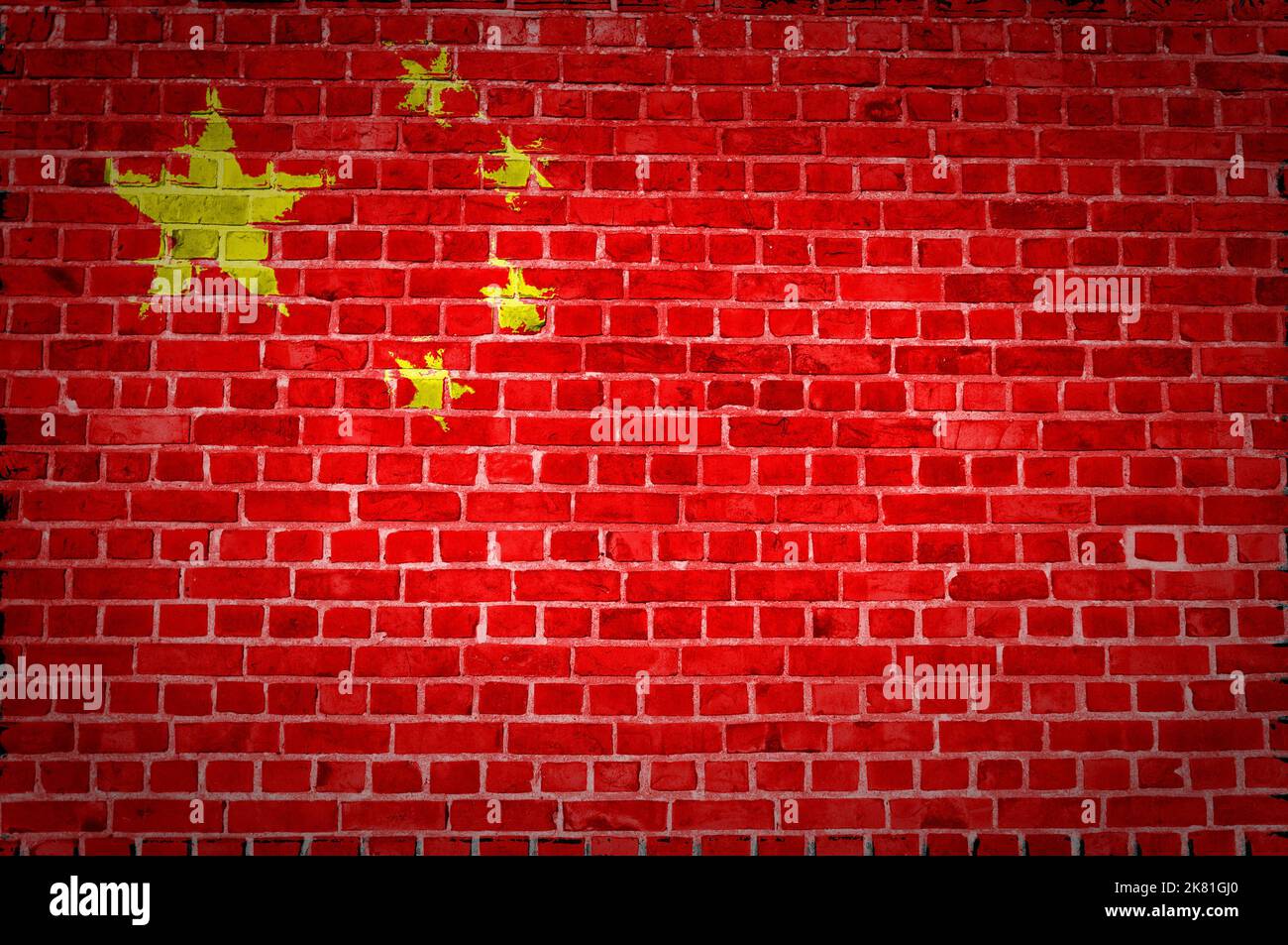 An image of the China flag painted on a brick wall in an urban location ...