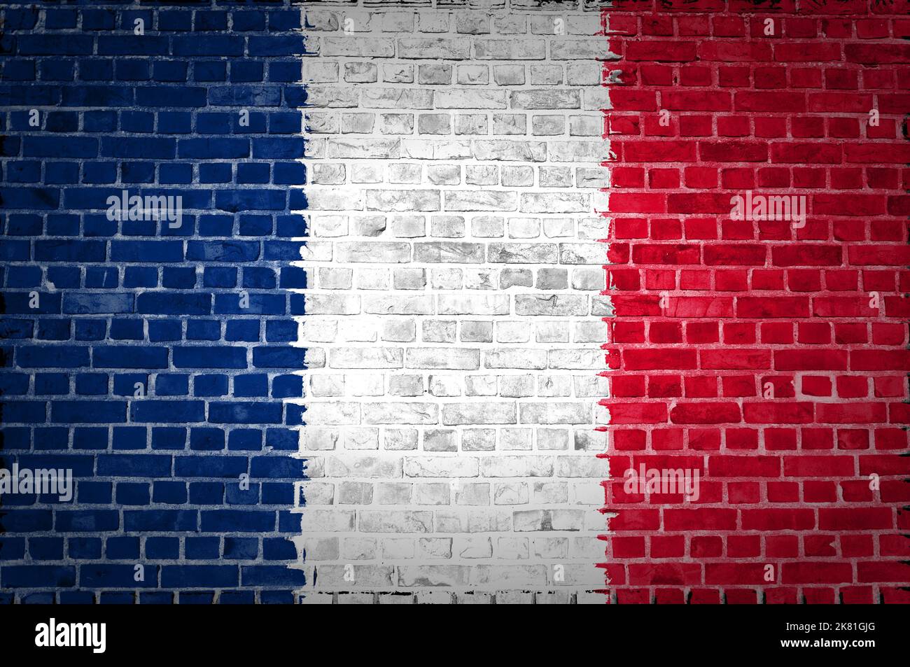 An image of the France flag painted on a brick wall in an urban ...
