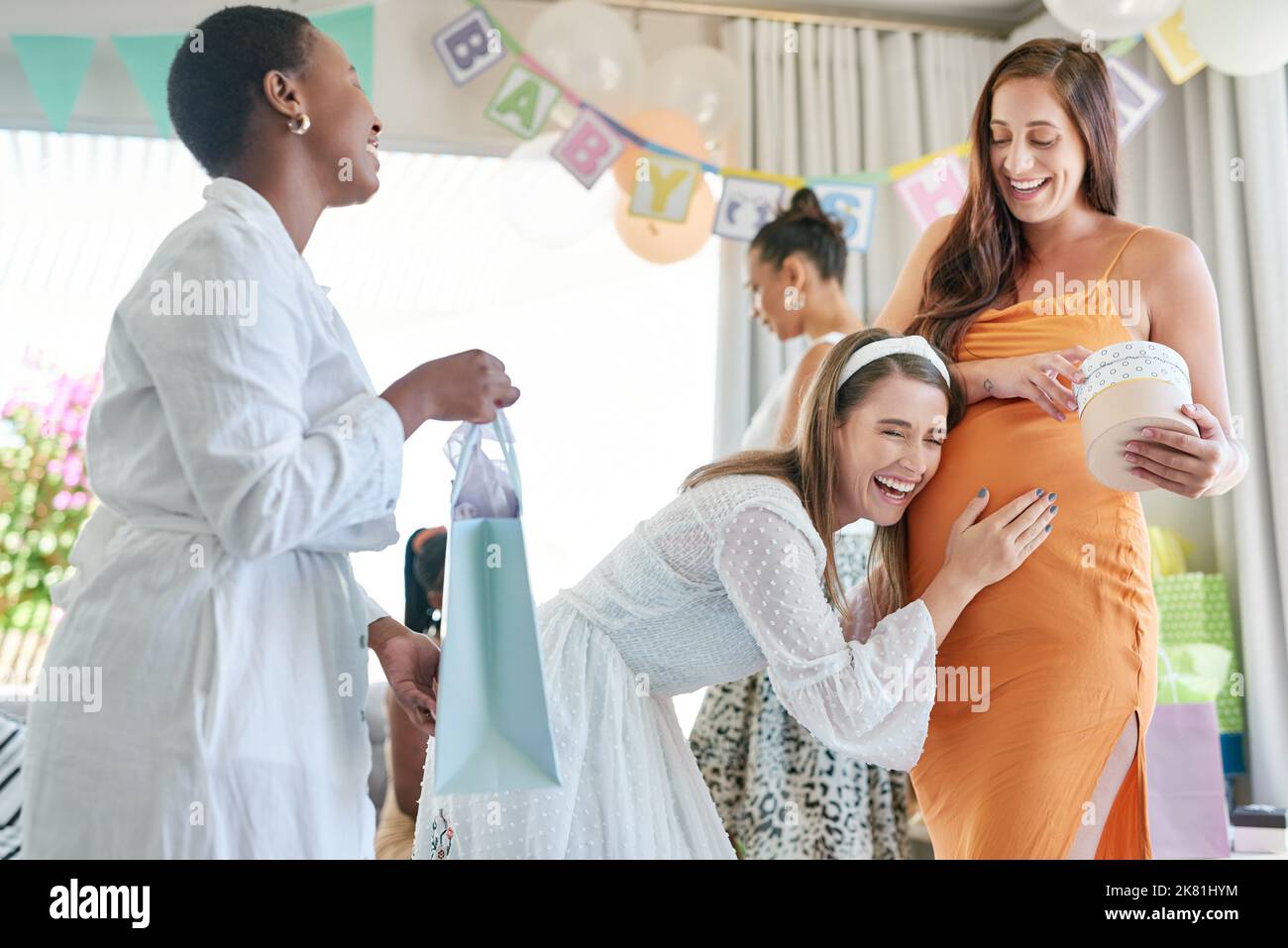 Were all so happy for you. a pregnant mother to be receiving gifts from
