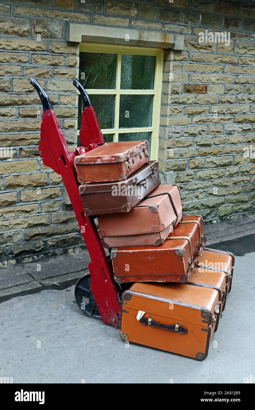 Old fashioned suitcases on hand cart, on Haworth Station on Keighley& Worth Valley Railway Stock Photo