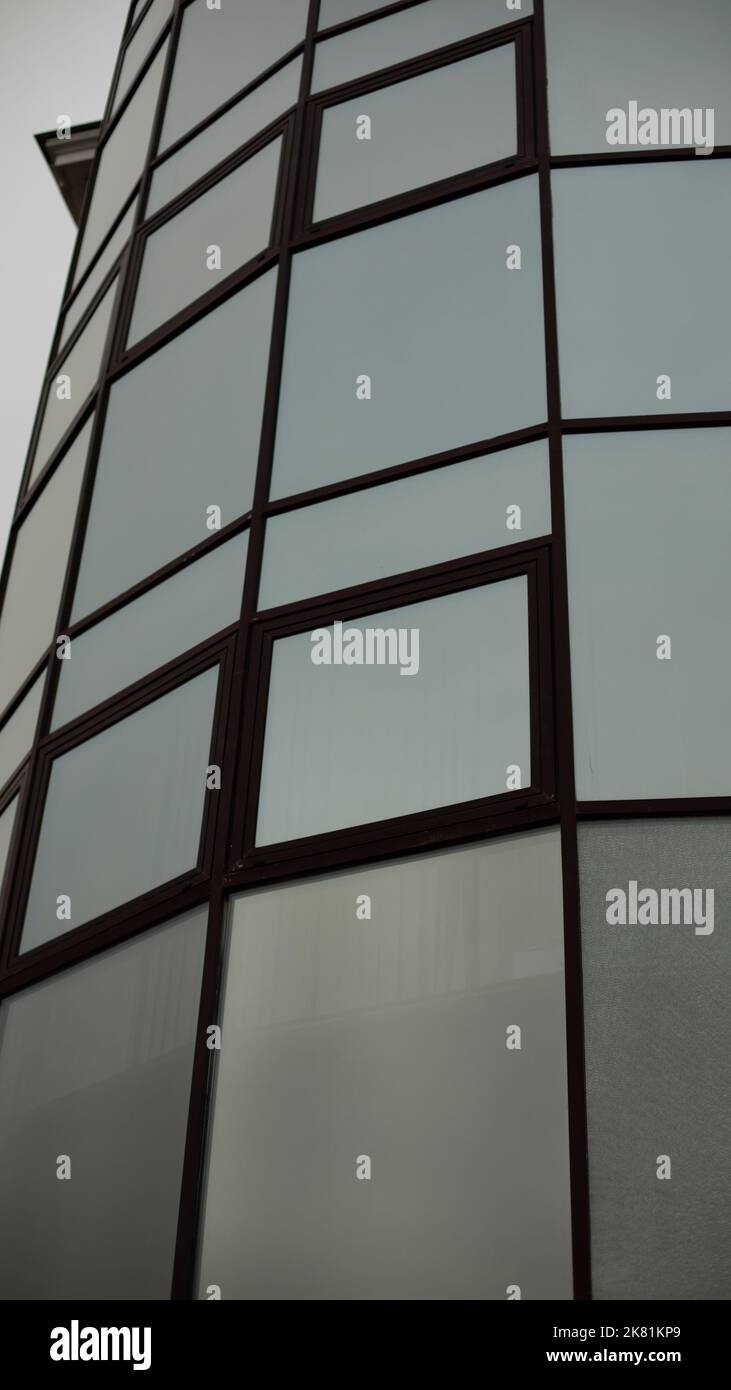 Tiles made of mirrors. Mirrored windows squares. Round building