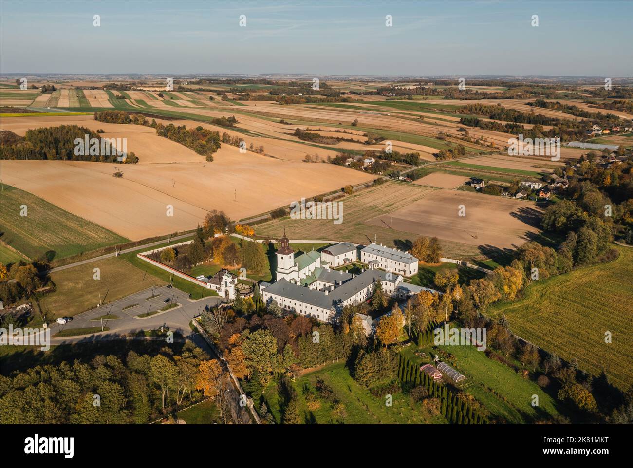 Imbramowice, Lesser Poland Voivodeship, Premonstratensian (Norbertine) monastery drone aerial shot, autumn day. Stock Photo