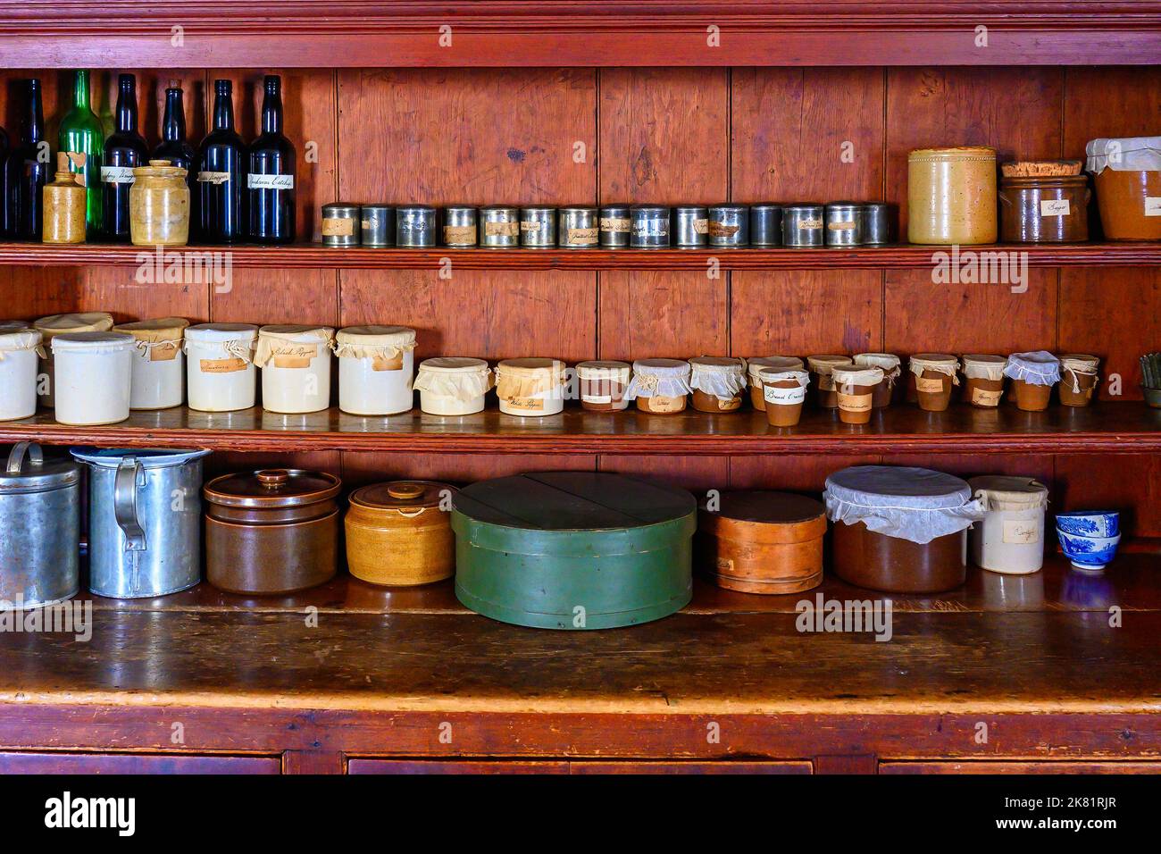 A colonial cupboard full of diverse containers. Fort York is a National Historic Site of Canada. Stock Photo