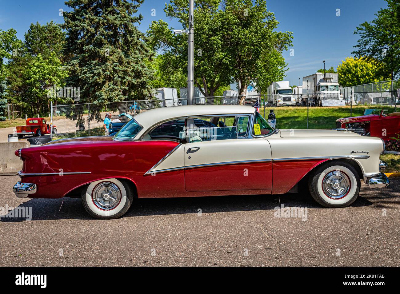 Falcon Heights, MN - June 19, 2022: High perspective side view of a 1954 Oldsmobile 98 Holiday Hardtop Coupe at a local car show. Stock Photo