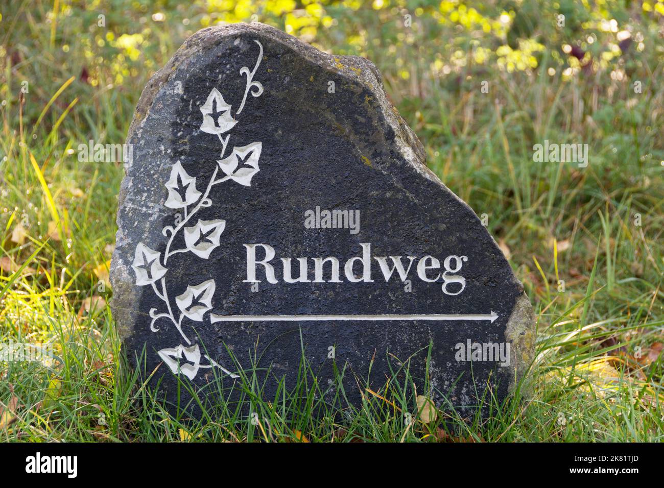 Natural stone with the German word 'Rundweg' (circular route) Stock Photo