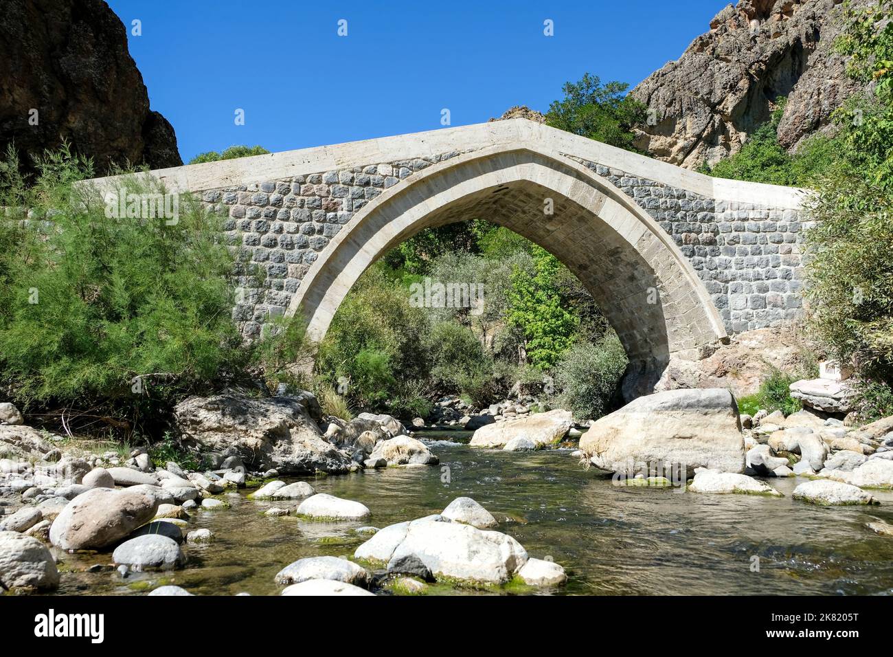 The historical Hanım Bridge, which is located on the Pülümür Stream within the borders of Tunceli's Pülümür district and was built in the 19th century Stock Photo