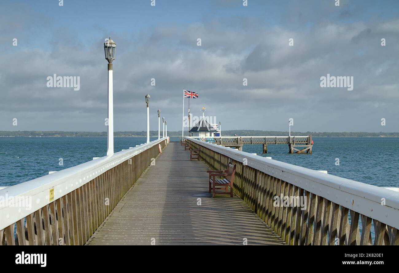 View Along Wooden Yarmouth Pier Towards The Roundhouse Museum And Across The Solent, Yarmouth, Isle Of Wight uk Stock Photo