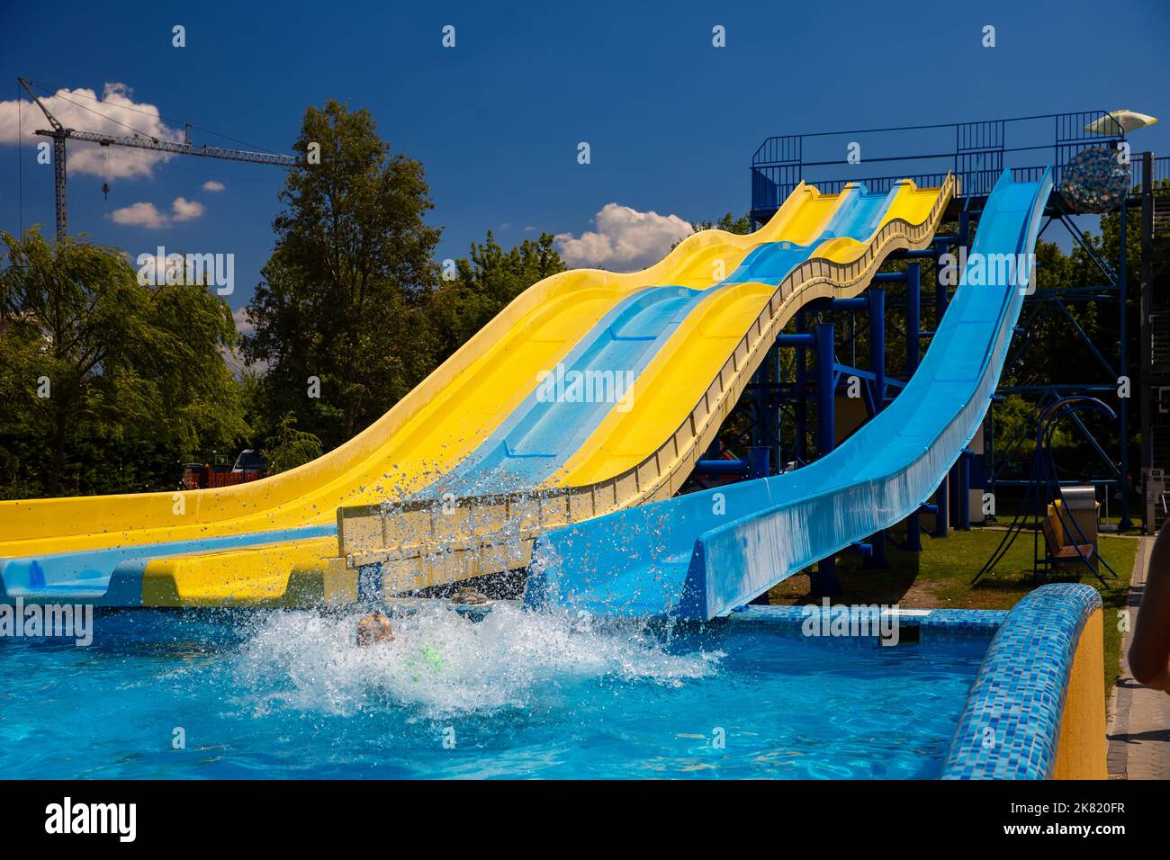 Yellow and blue color water slide in aquapark Stock Photo Alamy