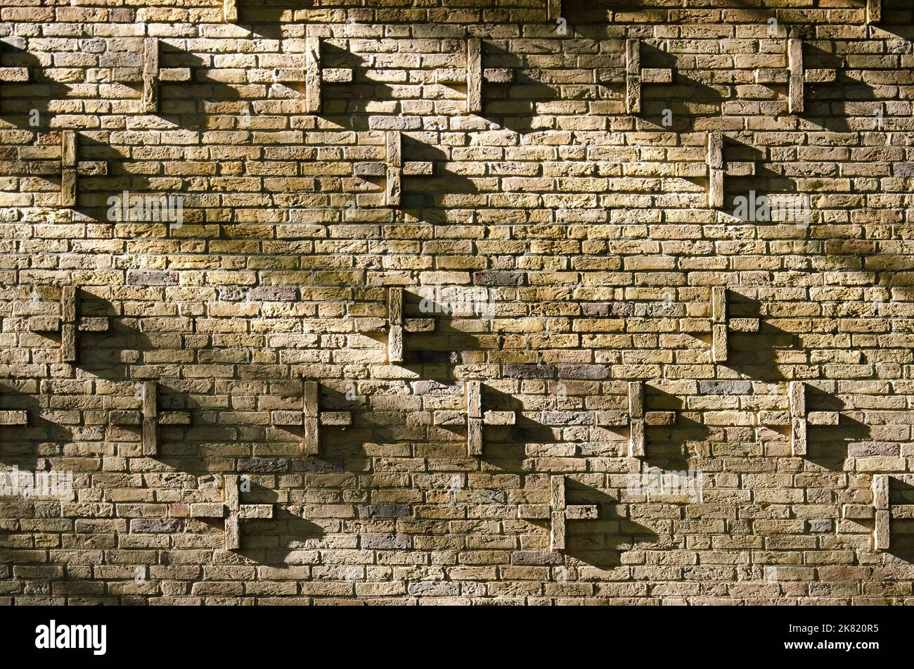 The Hague, The Netherlands, October 18, 2022: sunlight and shadow on the ornamental masonry of a facade of the Dalton college school buidling Stock Photo