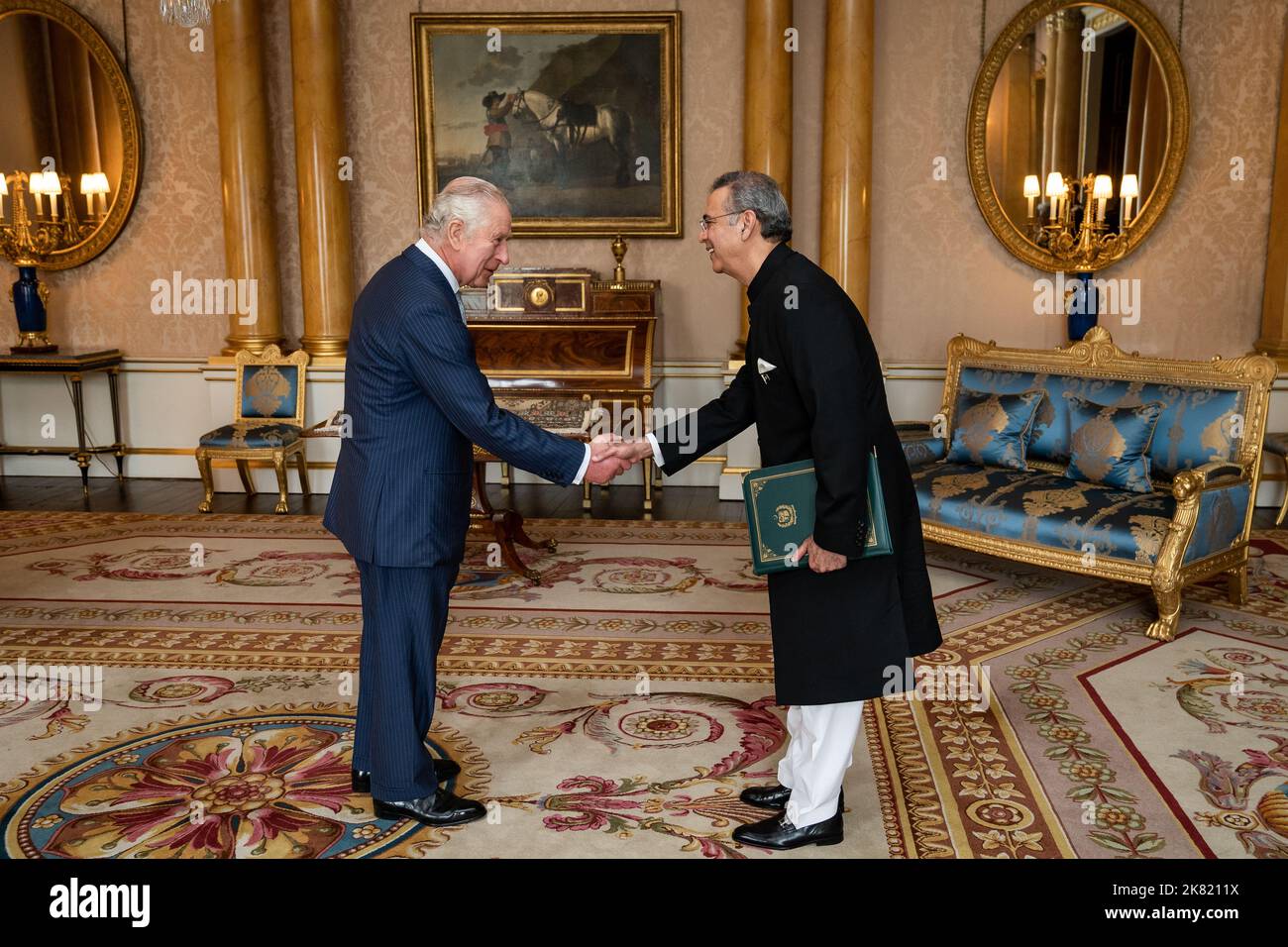 King Charles III during an audience with Mr Moazzam Ahmad Khan and presented the Letters of Recall of his predecessor and his own Letters of Commission as High Commissioner for the Islamic Republic of Pakistan in London at Buckingham Palace, London. Picture date: Thursday October 20, 2022. Stock Photo